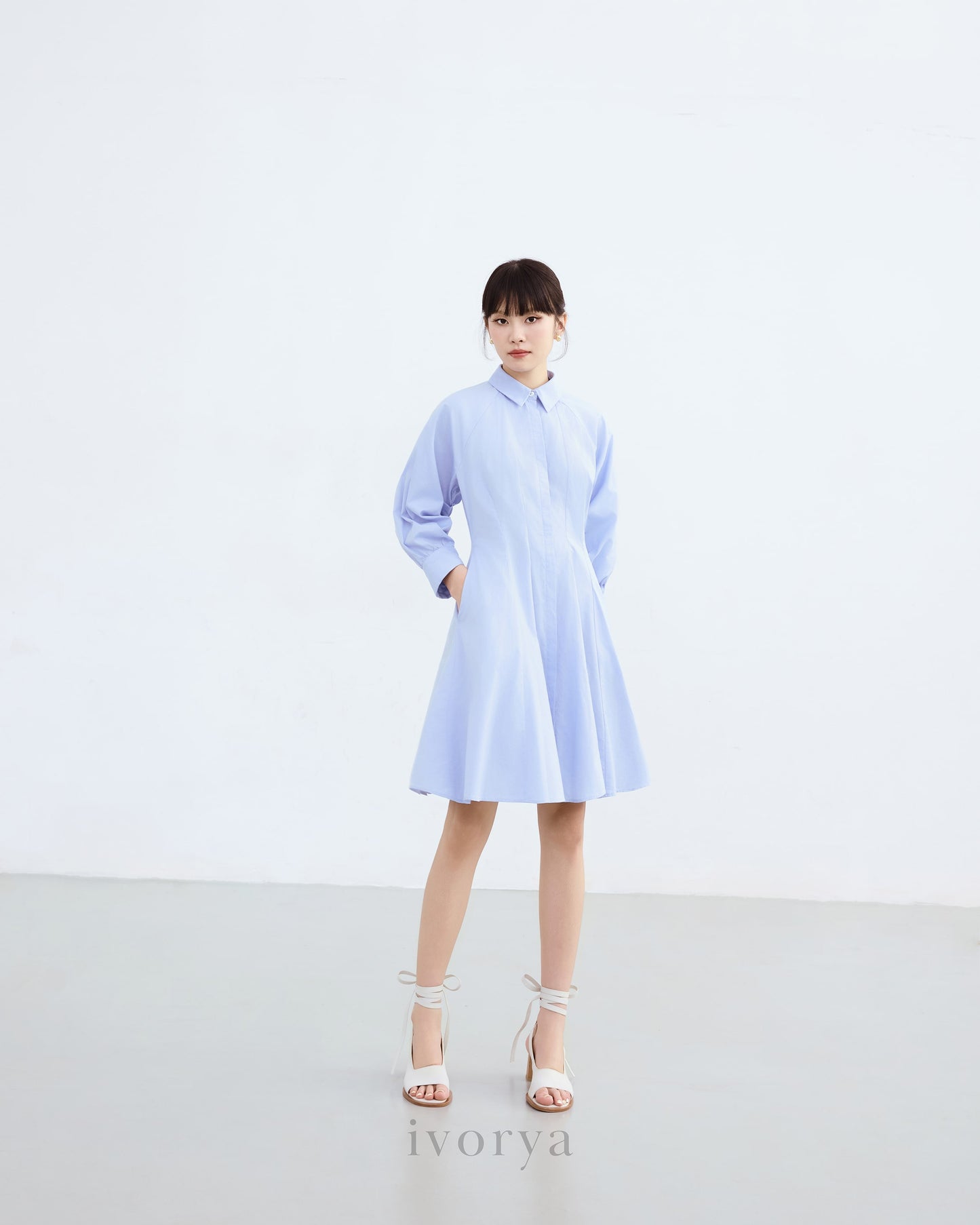 Đầm sơ mi màu xanh dương nhạt, tay dài xếp ly cách điệu - YD9836