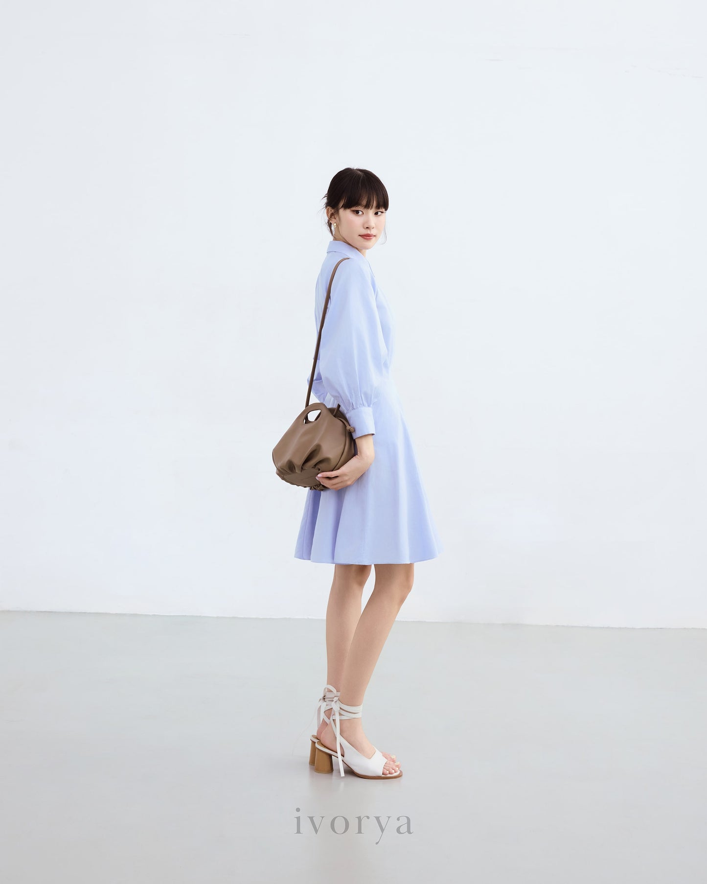 Đầm sơ mi màu xanh dương nhạt, tay dài xếp ly cách điệu - YD9836