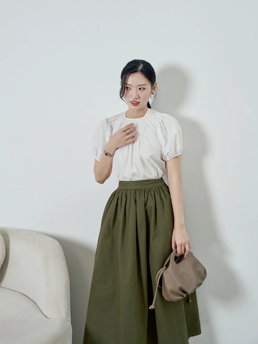 Áo nữ màu trắng, cổ tròn xếp ly và tay áo phồng - SH9932